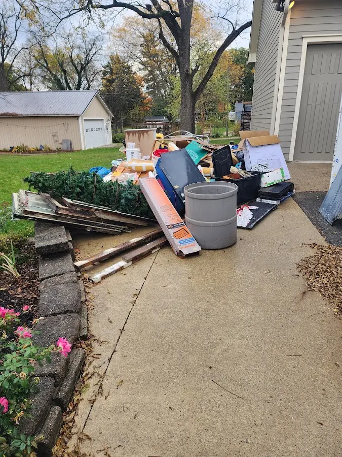 Dumpster being loaded with debris for 3 Yard Dumpster Rental in Manitowoc